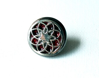flower lapel pin with red background