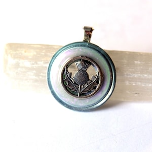 Scottish thistle pendant with pink opal background