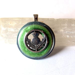 Scottish thistle pendant with green background