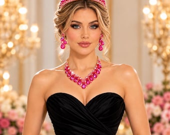 May include: A jewelry set consisting of a tiara, drop earrings, and a necklace, all featuring vibrant hot pink teardrop-shaped crystals and small white pearls set in a metallic frame, worn with a strapless black dress.