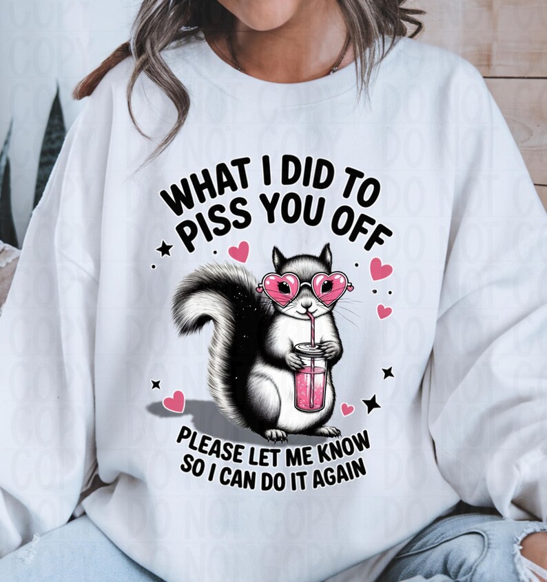 Woman wearing white sweatshirt with sassy squirrel design what I did to piss you off funny Valentine shirt