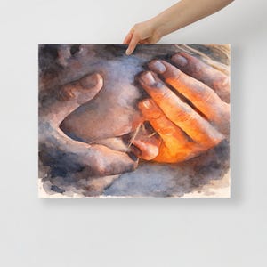May include: Watercolor painting of hands and a face. The hands are a warm orange color, and the face is a mix of blues and grays. The artwork is held by a person's hand against a white background.