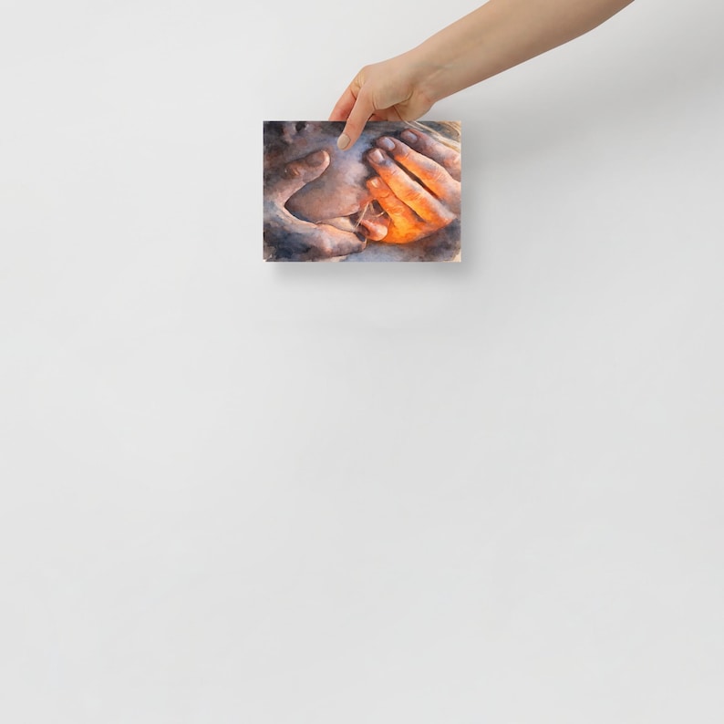 May include: A small, rectangular canvas print featuring a watercolor painting of hands. The hands are depicted in shades of orange, brown, and blue, with a focus on the interplay of light and shadow. The artwork evokes a sense of warmth and connection.
