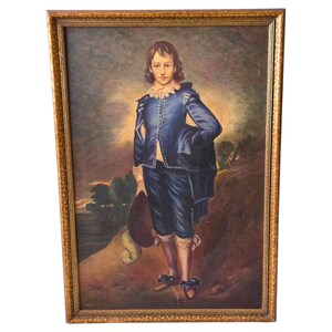 May include: An oil painting in a textured gold frame depicting a person with shoulder-length brown hair wearing a blue doublet and breeches with a white ruffled collar. The figure stands in a landscape holding a dark hat, with light behind them.