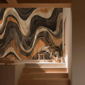 May include: A decorative wall mural with a wavy pattern in shades of brown, tan, and black. The design features flowing lines and a textured appearance. A small wooden stool and a potted plant are in front of the mural.