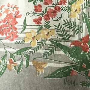 May include: A textile fabric featuring a printed pattern of red, yellow, and orange flowers with green leaves and stems. The background consists of alternating light gray and white horizontal stripes. The signature V519 is printed in the bottom right corner.
