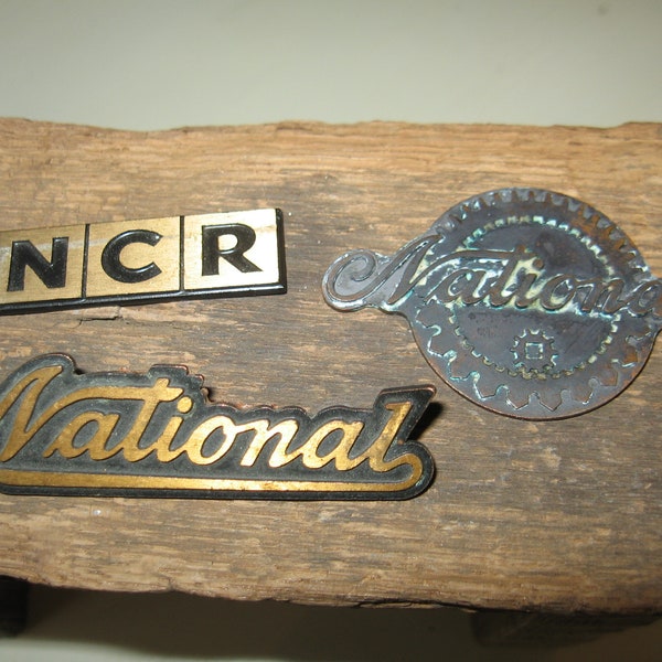 National Cash Register Co NCR set of three Emblems 2 National and 1 NCR Dayton Ohio