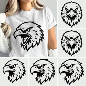 以下が含まれることがあります： 白いTシャツに、ワシの頭の大胆な白黒グラフィック。このデザインは、詳細な線画でワシの激しい表情を表現しています。追加のワシの頭のデザインが、右上と右下に表示されています。