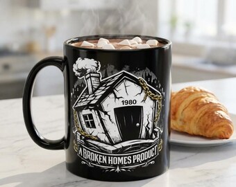 Taza de cerámica negra de Broken Homes