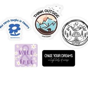 May include: A collection of stickers with various designs and text. One sticker features a blue flower with the quote "The earth laughs in flowers." Another says "THINK OUTSIDE" with a mountain scene. Other stickers say "WILD & FREE" and "CHASE YOUR DREAMS in high heels, of course."