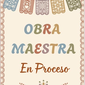 May include: A cream-colored sign with the words "OBRA MAESTRA En Proceso" in colorful letters. The sign is decorated with a garland of cut-out paper banners and a decorative border.