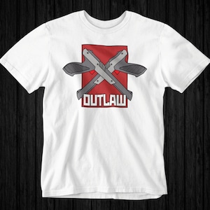 May include: White t-shirt with a red square graphic featuring two crossed guns and the word "OUTLAW" in white text.