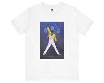 May include: White t-shirt with a graphic print of Freddie Mercury in a yellow jacket, singing with a microphone. The text "Who Wants To Live Forever" and "Freddie Mercury 1946-1991" are printed below the image.