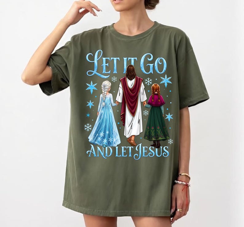 May include: Olive green t-shirt featuring the text "Let It Go and Let Jesus" in blue script. The graphic depicts Jesus holding hands with two figures in blue and green dresses, with snowflakes.