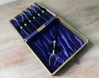 Six VINTAGE Bakelite EPNS A1 forks and large serving fork in original box.