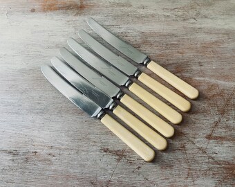 Six VINTAGE GROSVENOR bone handle knives.