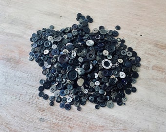 Six Hundred and Seventy assorted blue / black / grey buttons. My Vintage home.