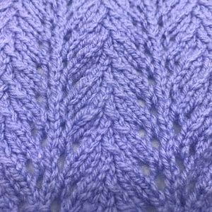 Manta de bebé de encaje tejida en telar