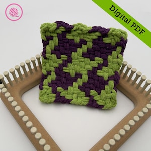 May include: A woven square in shades of green and purple, possibly a potholder or coaster, sits on a wooden loom. The words "Digital PDF" are in a green banner. A pink and white yarn logo is in the upper left corner.