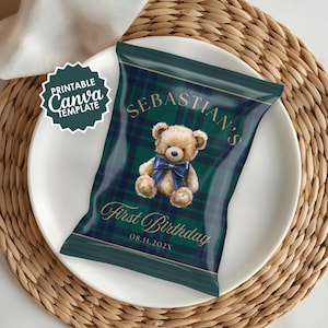 May include: A dark green and navy plaid party favor bag with the text "Sebastian's First Birthday" and a teddy bear illustration. The bag is on a white plate and a woven placemat. The Canva template logo is in the upper left corner.