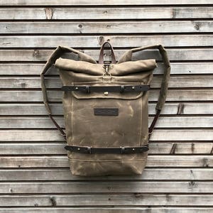 Waxed canvas backpack rucksack with folded top and waxed canvas padded shoulder straps image 1