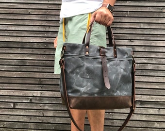 Tote bag in waxed canvas with leather bottom and cross body strap