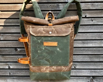Waterproof waxed canvas backpack with detachable leather side straps and padded laptop compartment / padded shoulder straps