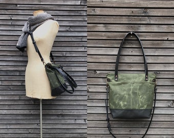 Waxed canvas leather tote bag in olive green with zipper closure and cross body strap