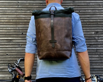 Leather backpack with waxed canvas  roll to close top and vegetable tanned shoulder straps