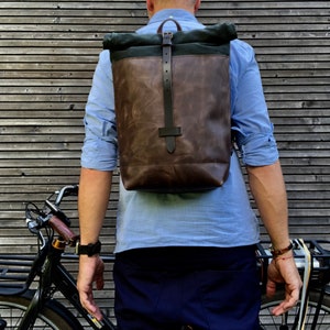 Leather backpack with waxed canvas  roll to close top and vegetable tanned shoulder straps