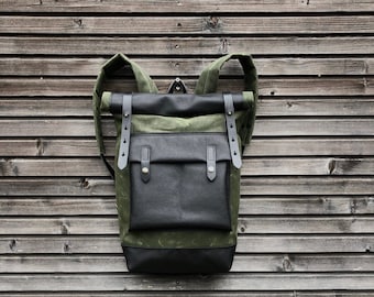 Waxed canvas backpack with roll up top and  leather bottom and outside pocket COLLECTION UNISEX