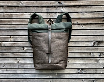 Vegan backpack in brown Piñatex™ and forest green waxed canvas with roll to close top