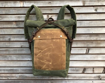 olive green backpack medium size rucksack in waxed canvas, with volume front pocket and double layered bottom
