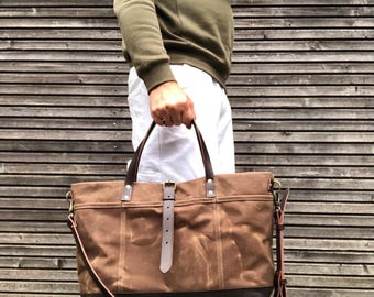 XL carryal  made in tan waxed canvas  with leather handles and shoulder strap
