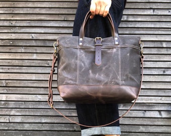 Waxed canvas tote bag with leather handles and shoulder strap