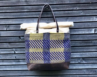 Carryall in waxed canvas tote bag with handwoven exterior pocket