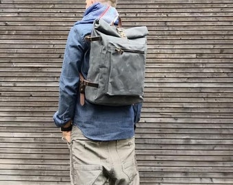 Waxed canvas backpack with roll to close top and vegetable tanned leather shoulderstraps