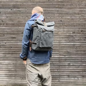 Waxed canvas backpack with roll to close top and vegetable tanned leather shoulderstraps image 1