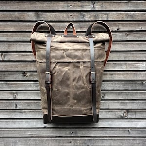 Waxed canvas rucksack/backpack with roll up top and waxed leather shoulderstrap,handle and leather bottem COLLECTION UNISEX