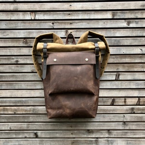 Leather backpack with waxed canvas  roll to close top and leather front pocket