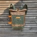 Waterproof waxed canvas backpack with detachable leather side straps and padded laptop compartment / padded shoulder straps