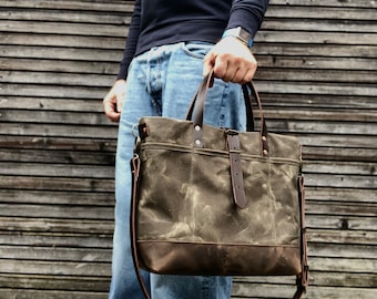 Tote bag in waxed canvas with leather bottom and cross body strap
