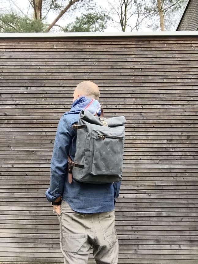 Waxed canvas backpack with roll to close top and vegetable tanned leather shoulderstraps