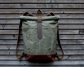 Waxed canvas rucksack / backpack with roll up top and leather shoulderstrap,handle and leather bottem COLLECTION UNISEX