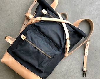 Backpack made in waxed canvas and vegetable tanned leather with 2 zipper pockets