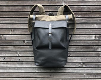 Leather backpack with waxed canvas  roll to close top and leather front pocket