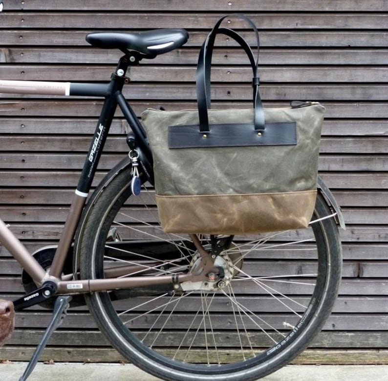pannier bag made in olive and field tan waxed canvas with black leather attachment and leather shoulder straps