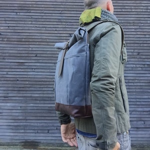 Waxed canvas rucksack / backpack with roll up top and leather shoulderstrap,handle and leather bottem COLLECTION UNISEX