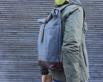 Waxed canvas rucksack / backpack with roll up top and leather shoulderstrap,handle and leather bottem COLLECTION UNISEX
