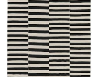 May include: A rectangular rug with a bold black and white striped pattern. The stripes run horizontally across the rug, creating a modern and graphic design. The rug is likely made of a woven material and would be suitable for a living room or bedroom.